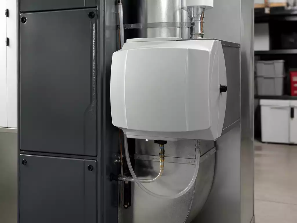 Modern furnace humidifier connected to a home HVAC system, showing proper installation and maintenance